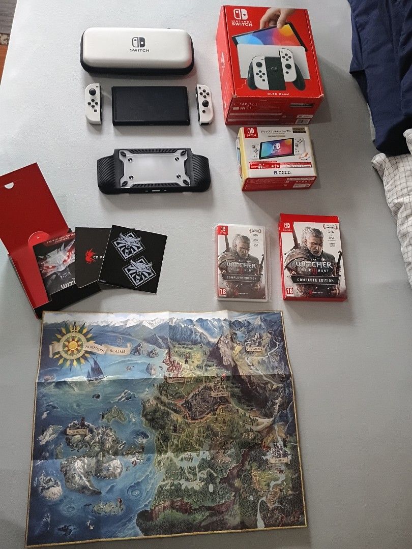 Nintendo Switch OLED with game and accessories (Category: Nintendo) located in Marikina City. Submitted by heydjsm (Listing ID 1471072417, Image 2). Description: NO ISSUES LIKE BUYING A NEW SWITCH Take all for 15k only - Nintendo Switch OLED Model (White) with ori - White Joy-Cons and matching white carrying case - Black protective grip case for handheld play - Horipad controller included - The Witcher 3 Complete Edition cartridge with map, stick