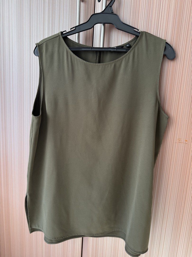 Olive Green Sleeveless Top Size XL (Category: Sleeveless) located in Manila. Submitted by k.pre_loved_collections (Listing ID 1471008227, Image 1). Description: - Item: Olive green sleeveless blouse - Size: XL - Details: Round neckline, back button closure with keyhole, side slits for extra movement - Fabric: Lightweight and easy to style for work or casual wear - Condition: Noticeable mild fabric fuzziness/wear on the front center area (closely 