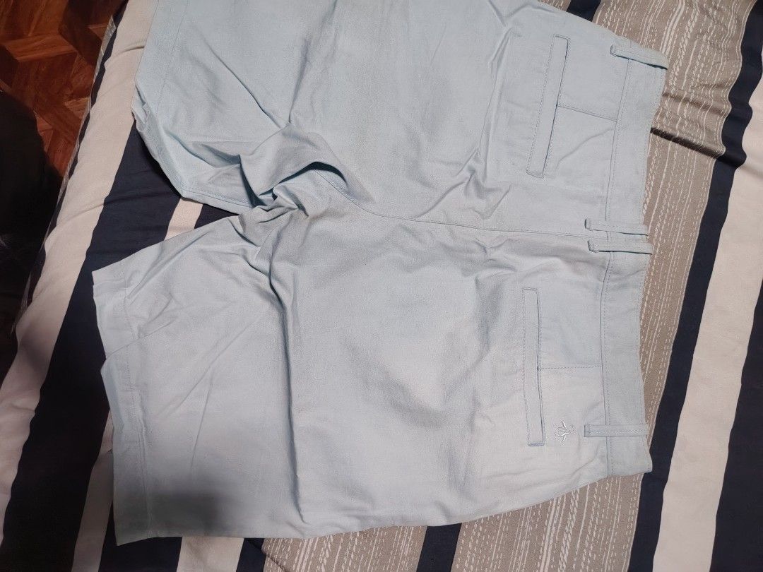 Original Penguin Light Blue Shorts Size 32 (Category: Shorts) located in Manila. Submitted by snooks1938 (Listing ID 1471097404, Image 3). Description: - Brand: Original Penguin - Size: 32 - Color: Light blue - Closure: Button closure - Pockets: Front coin pocket and back welt pockets with penguin logo embroidery - Details: Blue floral print fabric lining on the interior waistband - Origin: Made in Vietnam - Condition/Style: Classic casual shorts