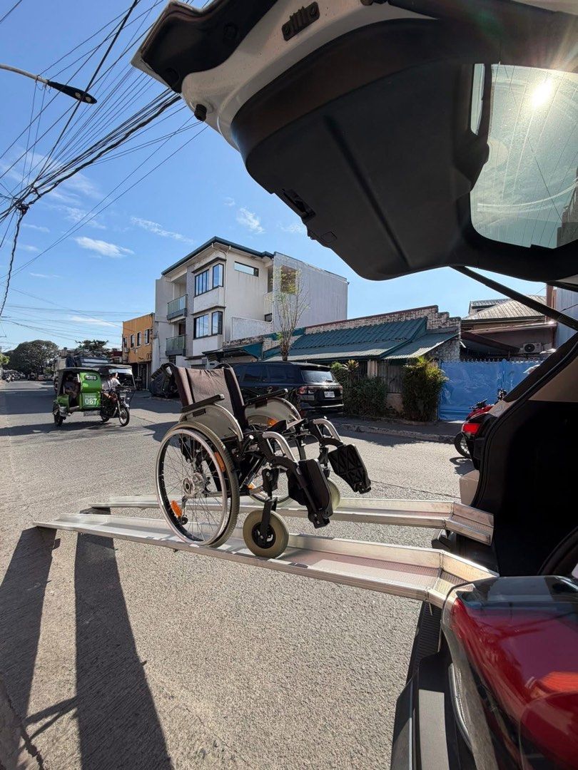 Ottobock wheelchair with loading ramps (Category: Wheelchairs) located in Manila. Submitted by calmdolphin.87b0e4 (Listing ID 1470961319, Image 1). Description: - Brand: Ottobock manual wheelchair - Included: Matching long aluminum loading ramps for easy vehicle transport - Design: Foldable metal frame with clean gray fabric seat and backrest - Wheels: Large spoked rear wheels with reflectors and solid front casters - Condition: Excellent, clean,
