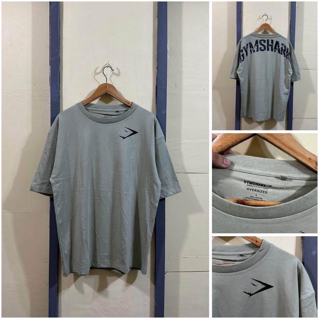 Oversized Gymshark Tshirt (Category: Activewear) located in Dapitan. Submitted by thrift_archive2026 (Listing ID 1471025756, Image 1). Description: 𝐨𝐯𝐞𝐫𝐬𝐢𝐳𝐞𝐝 𝐆𝐲𝐦𝐬𝐡𝐚𝐫𝐤 𝐭-𝐬𝐡𝐢𝐫𝐭 𝐰𝐢𝐭𝐡 𝐚 𝐬𝐦𝐚𝐥𝐥 𝐛𝐥𝐚𝐜𝐤 𝐥𝐨𝐠𝐨 𝐨𝐧 𝐭𝐡𝐞 𝐜𝐡𝐞𝐬𝐭 𝐚𝐧𝐝 𝐥𝐚𝐫𝐠𝐞 “𝐆𝐘𝐌𝐒𝐇𝐀𝐑𝐊” 𝐥𝐞𝐭𝐭𝐞𝐫𝐢𝐧𝐠 𝐚𝐜𝐫𝐨𝐬𝐬 𝐭𝐡𝐞 𝐮𝐩𝐩𝐞𝐫 𝐛𝐚𝐜𝐤. 𝐒𝐢𝐳𝐞: 𝐋 𝐃𝐢𝐦𝐞𝐬 :𝟐𝟐.𝟓𝐱𝟐𝟖 780 freeship.