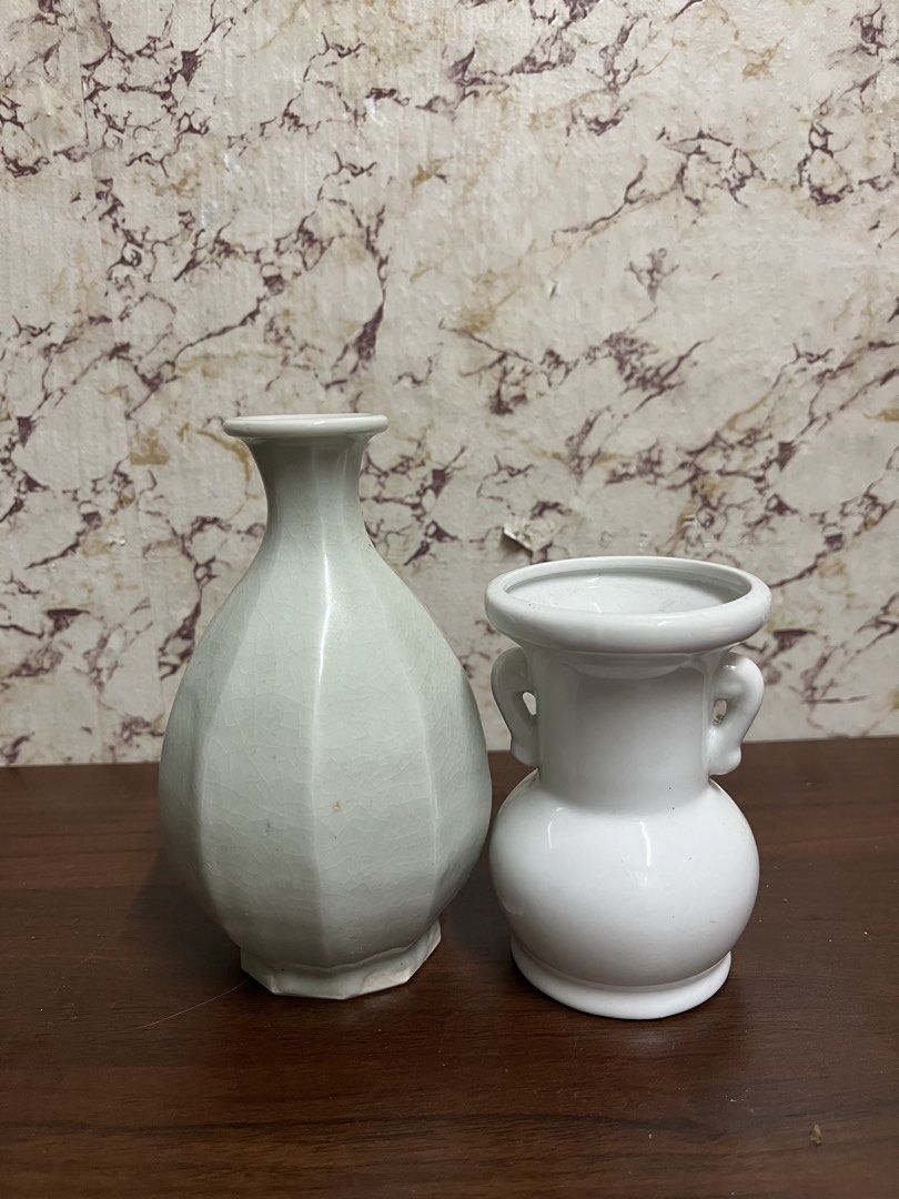 Pair of Small Ceramic Vases (Category: Vases & Decorative Bowls) located in Manila. Submitted by kayerrr.gem (Listing ID 1471047478, Image 1). Description: - Set of 2 decorative ceramic vases for home styling - Tall vase features a faceted design, light green shade, and crackle glaze finish - Short vase is white, rounded, and accented with small side handles - Ideal for coffee table centerpieces, shelf styling, and small floral arrangements - Per