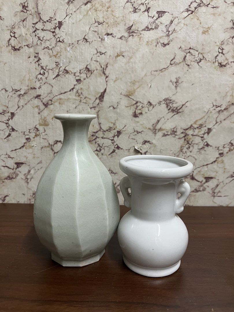 Pair of Small Ceramic Vases (Category: Vases & Decorative Bowls) located in Manila. Submitted by kayerrr.gem (Listing ID 1471047478, Image 2). Description: - Set of 2 decorative ceramic vases for home styling - Tall vase features a faceted design, light green shade, and crackle glaze finish - Short vase is white, rounded, and accented with small side handles - Ideal for coffee table centerpieces, shelf styling, and small floral arrangements - Per