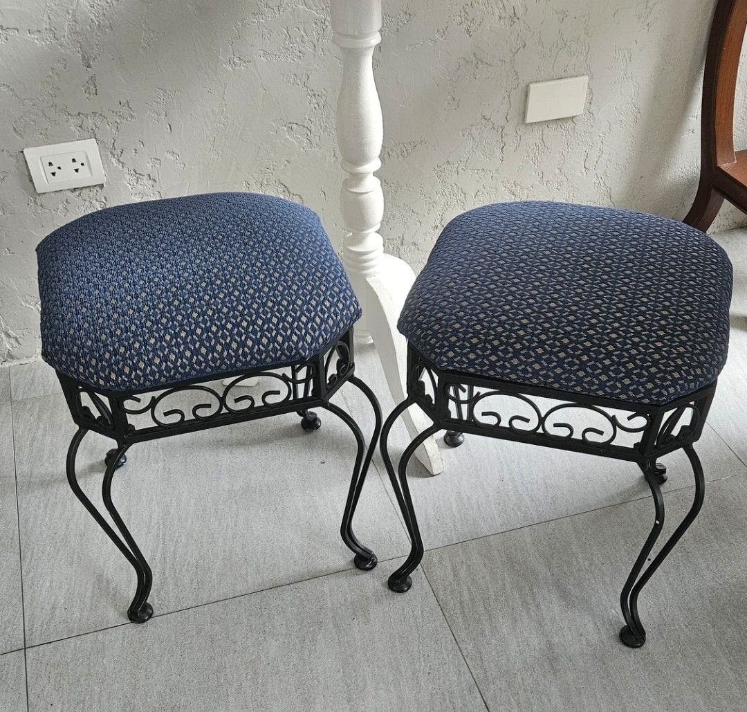 Pair of Wrought Iron Stools with Blue Patterned Cushions (Category: Chairs) located in Manila. Submitted by cosmicshark-cd31f1 (Listing ID 1471025946, Image 1). Description: - Set of 2 matching stools - Black wrought iron frames with decorative scrollwork - Upholstered cushion tops in a blue geometric diamond pattern - Curved legs for sturdy and reliable support - Perfect extra seating for the living room, vanity, or bedroom corners - Clean condi