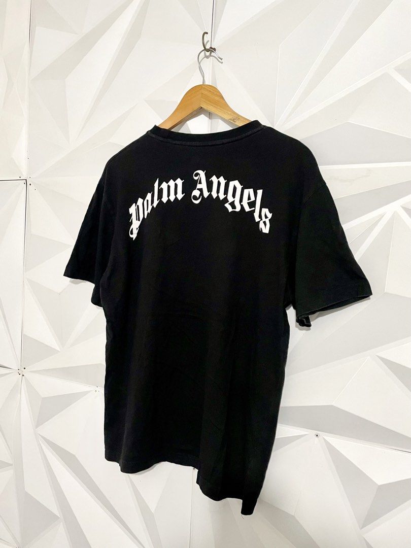 Palm Angels Bear Black T-Shirt (Category: Shirts) located in Cabuyao City. Submitted by ParadisethriftedPh (Listing ID 1471118335, Image 3). Description: Cr: 9.2/10 Dimensions W: 20.5 L: 27 - Brand: Palm Angels - Color: Classic Black - Design: Iconic bear graphic on front with bold white gothic lettering on back shoulders - Fit: Short sleeves, crew neck - Material: Premium cotton - Style: Clean streetwear staple, highly versatile - Condition: Bra