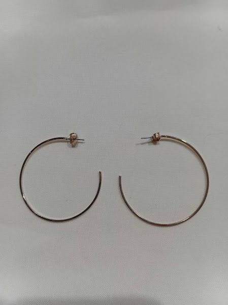 Parfois Gold Hoop Earrings (Category: Earrings) located in Caloocan City. Submitted by mma_222 (Listing ID 1471057661, Image 2). Description: - Brand: Parfois - Style: Large thin wire gold hoop earrings - Design: Simple and minimalist everyday accessory - Weight: Lightweight and comfortable on the ears - Inclusions: Comes with closure posts on original store display card.