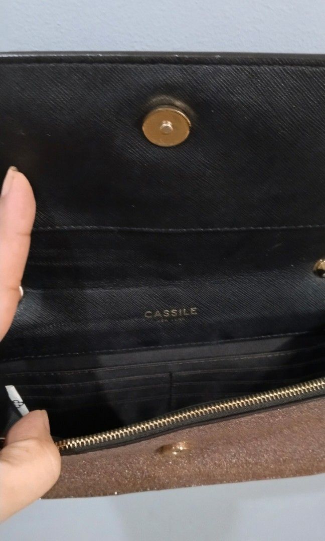 Party chain sling bag (Category: Cross-body Bags) located in Trece Martires City. Submitted by vherma (Listing ID 1470947910, Image 3). Description: rose-gold or pink glitter-finish evening clutch or sling bag with a gold-tone chain strap and a vertical gold center accent with a tassel drop..