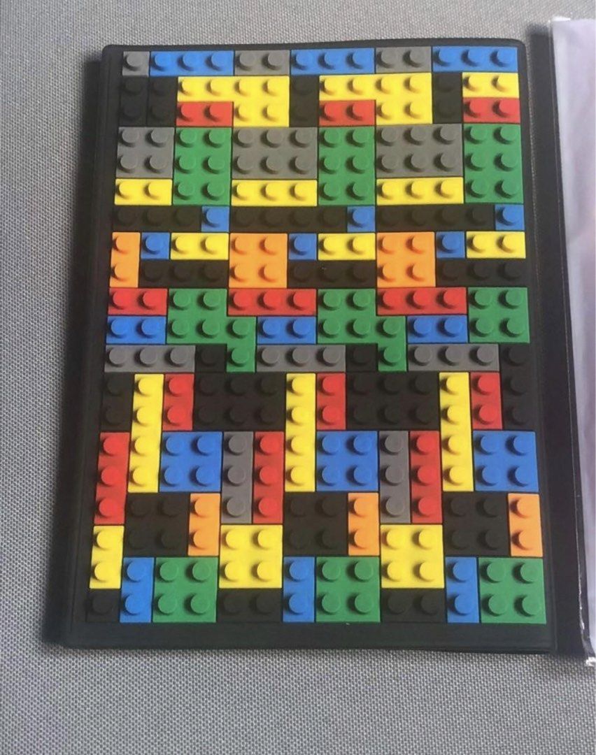 Passport Holder in LEGO Brick Pattern Design (Category: Everything Else Others) located in Calapan. Submitted by shakalak (Listing ID 1471050167, Image 2). Description: - Design: Vibrant colorful brick block pattern with a sleek dark spine and back - Never used medyo napunit na ang plastic Bought for 1500 Selling @ 599.