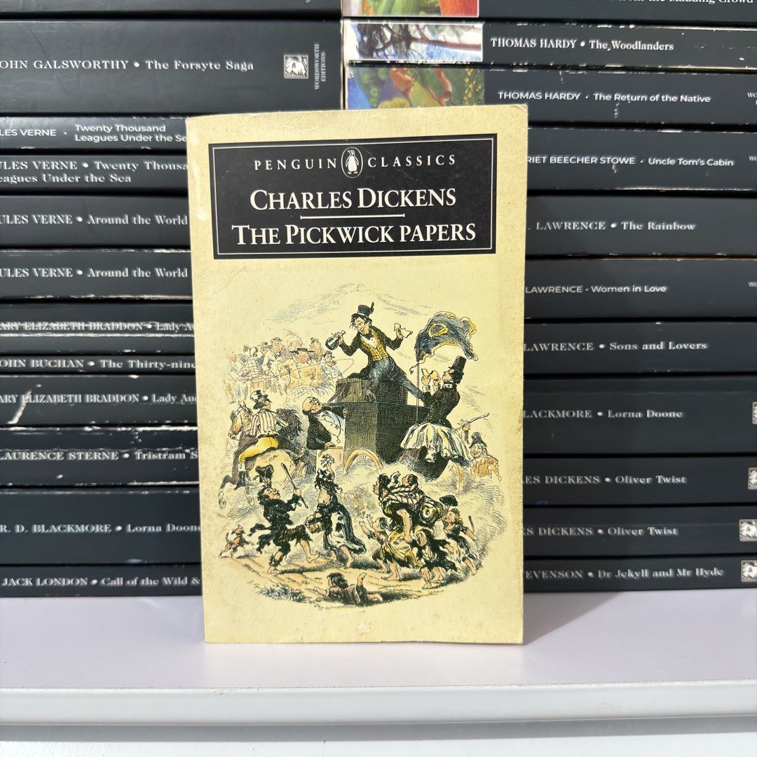 Penguin Classics The Pickwick Papers by Charles Dickens (Category: Storybooks) located in Lingayen. Submitted by readwjane (Listing ID 1471091538, Image 1). Description: - Title: The Pickwick Papers by Charles Dickens - Edition: Penguin Classics Paperback - Design: Iconic yellow cover with vintage illustration - Condition: Readable, pages intact, minor shelf wear on edges - Perfect for literature lovers and bookshelf styling.
