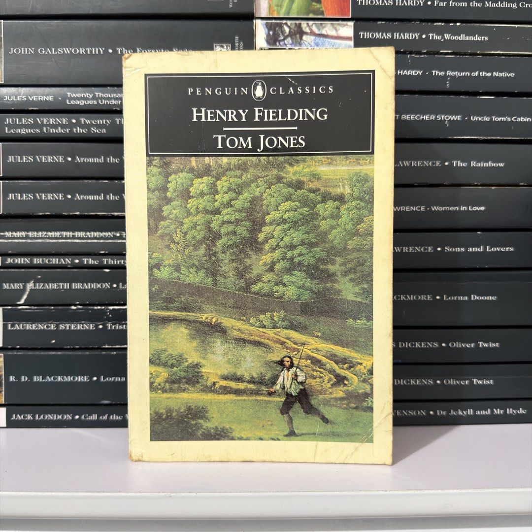Penguin Classics Tom Jones by Henry Fielding (Category: Storybooks) located in Lingayen. Submitted by readwjane (Listing ID 1471091537, Image 1). Description: - Title: Tom Jones by Henry Fielding - Edition: Penguin Classics (Softcover) - Cover: Vintage illustrated art - Condition: Yellowed borders and spine wear from shelf storage; pages are completely intact and readable - Perfect for classic literature fans and bookshelf displays.