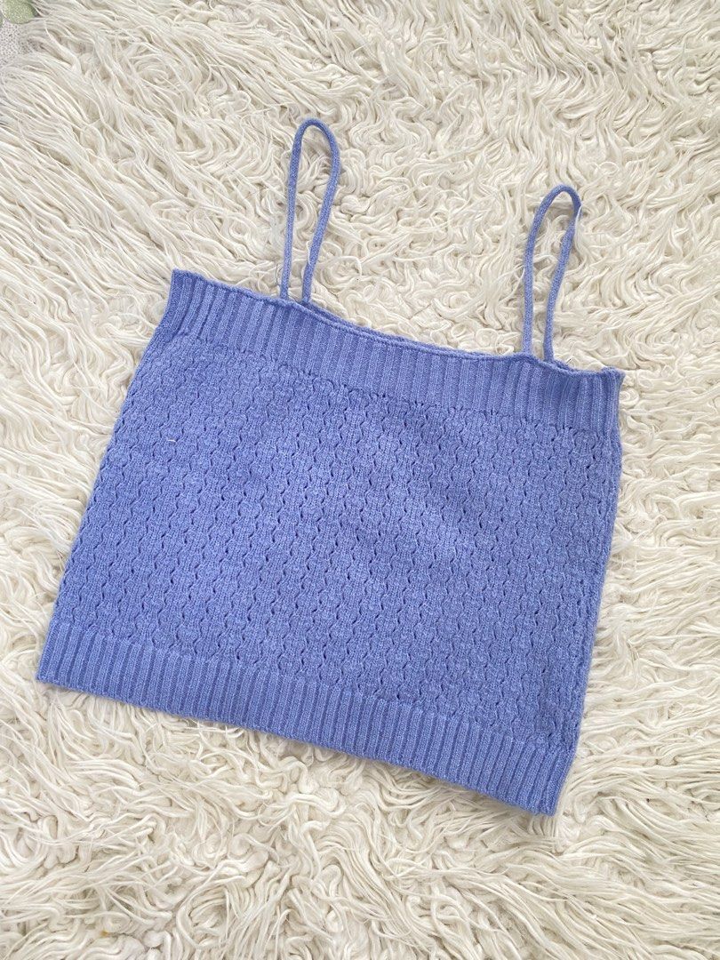 Periwinkle Blue Knit Camisole Crop Top (Category: Sleeveless) located in Tabaco. Submitted by camila_p (Listing ID 1470987018, Image 1). Description: - Color: Periwinkle blue - Material: Soft, very stretchy knit - Design: Textured pattern with ribbed trim at neckline and hem - Straps: Thin spaghetti straps - Styling: Perfect with high-waisted jeans or skirts.