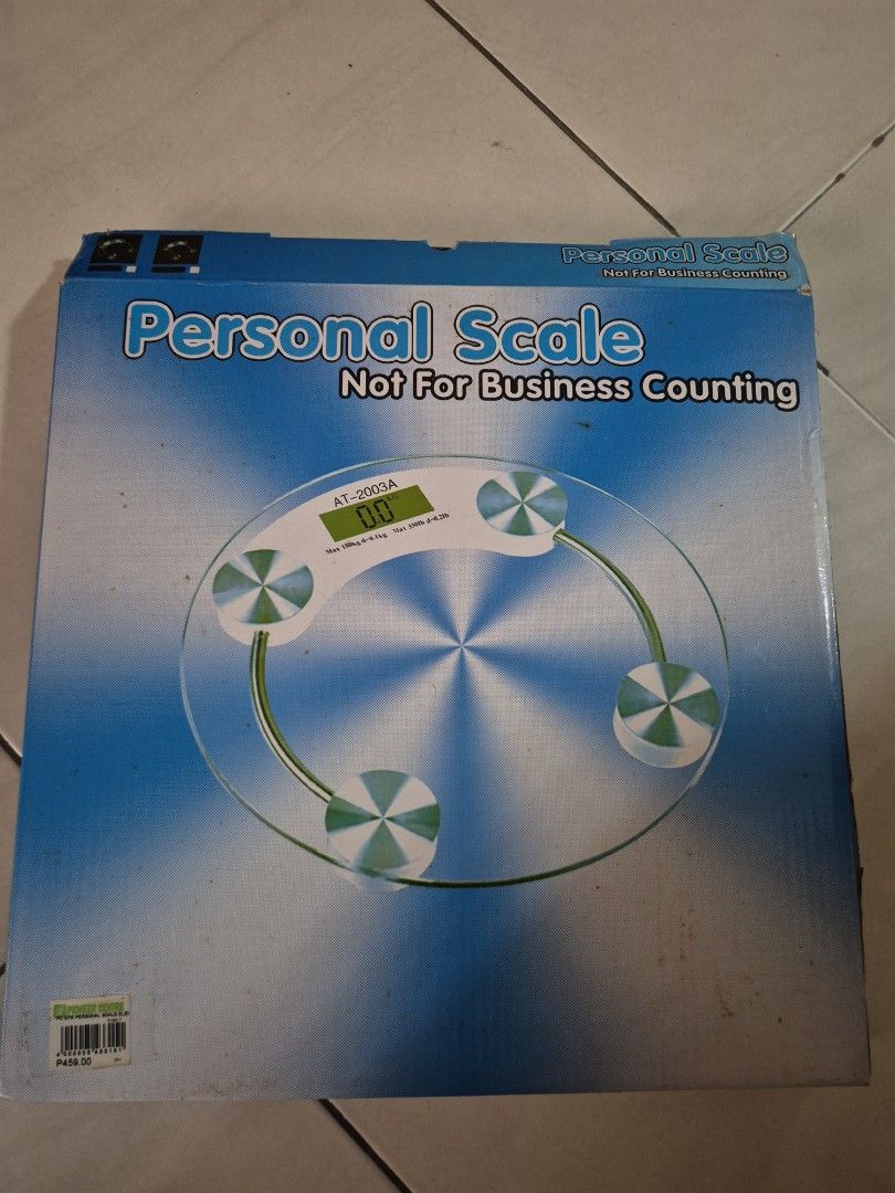 Personal Scale AT-2003B Digital Bathroom Scale (Category: Health Monitors & Weighing Scales) located in Manila. Submitted by matthew34567 (Listing ID 1471004391, Image 2). Description: - Model: AT-2003B Digital Personal Scale - Max capacity: 180kg - Design: Clear glass platform with stylish silver circular pad accents - Display: Clear digital screen for accurate weight readings - Condition: Fully operational and ready to use - Packaging: Comes wi
