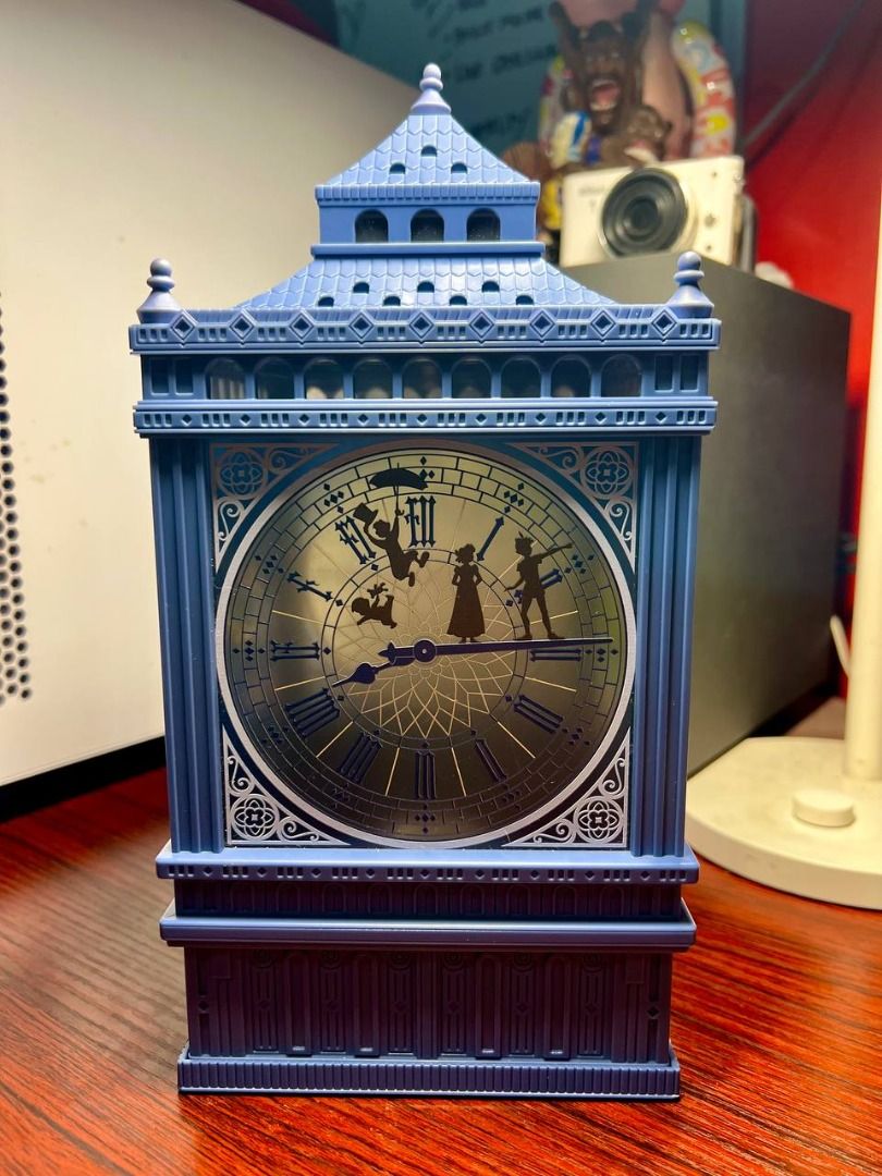 Peter Pan Clock tower Light Up PopCorn bucket (Category: Lighting) located in Baguio. Submitted by ditoyzb08176 (Listing ID 1471067065, Image 2). Description: - Official Disney Peter Pan lantern shaped like the Big Ben clock tower - Durable blue plastic frame with glowing illustrated panels - Panel 1: Peter Pan, Wendy, John, and Michael flying over London - Panel 2: Captain Hook and Smee on a pirate ship near Neverland - Clock face side features 