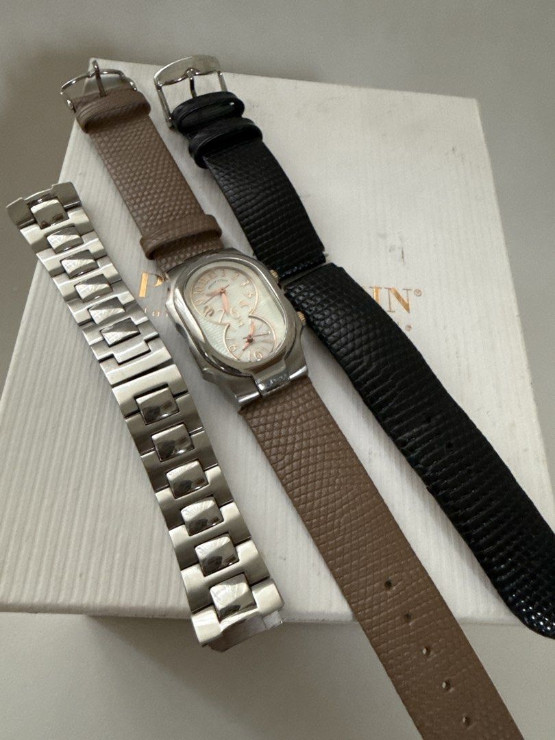 Philip Stein Dual Time Watch with Box and Extra Straps (Category: Women's Watches) located in Bulacan. Submitted by mynicetreasure (Listing ID 1470939844, Image 3). Description: - Brand: Philip Stein - Mother of Pearl face - Design: Dual time zone with silver dials and stainless steel case - Crowns: Two separate crowns on the right side - Inclusions: Original white box - Straps included: Mounted brown leather strap, spare black leather strap, and