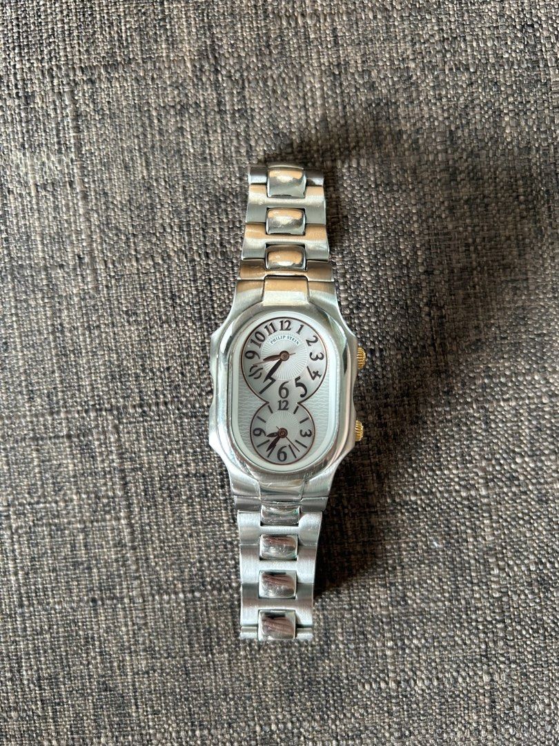 Philip Stein Dual Time Zone Watch with Extra Straps (Category: Women's Watches) located in Taguig. Submitted by shopourstyle.co (Listing ID 1470934842, Image 2). Description: - Authentic Philip Stein dual time zone wristwatch - Elegant stainless steel bracelet with gold crown accents - Reliable battery-operated quartz movement with dual Arabic numeral dials - Includes 2 interchangeable leather straps (Green and White) - Comes with extra metal lin