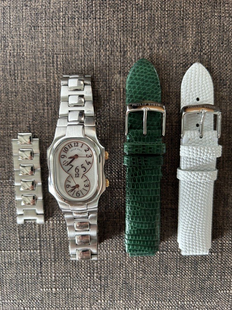 Philip Stein Dual Time Zone Watch with Extra Straps (Category: Women's Watches) located in Taguig. Submitted by shopourstyle.co (Listing ID 1470934842, Image 3). Description: - Authentic Philip Stein dual time zone wristwatch - Elegant stainless steel bracelet with gold crown accents - Reliable battery-operated quartz movement with dual Arabic numeral dials - Includes 2 interchangeable leather straps (Green and White) - Comes with extra metal lin