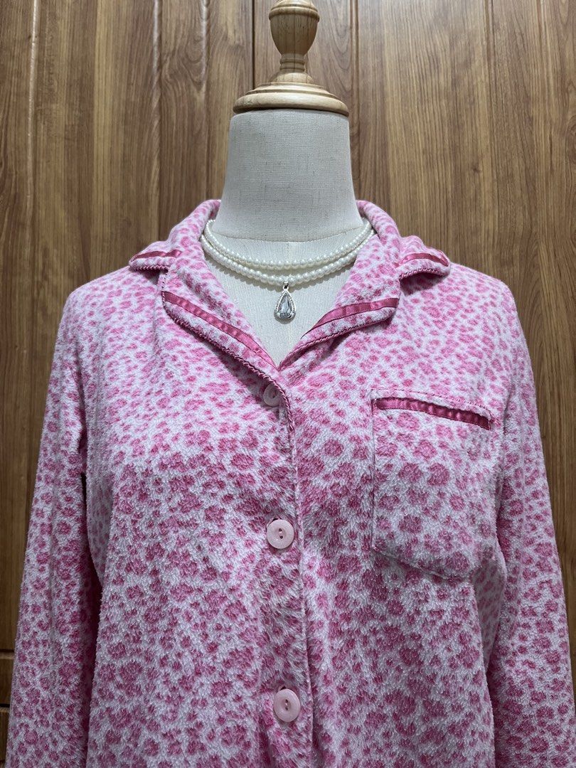 Pink leopard print (Category: Coats, Jackets and Outerwear) located in Manila. Submitted by brightwind_62659f (Listing ID 1471094301, Image 3). Description: - Fluffy pink and white leopard print design - Classic collar with satin pink trim and matching chest pocket - Front button closure with cute pink round buttons - Long sleeves made from super soft and cozy material - Ideal for lounging at home or sleeping in comfort.