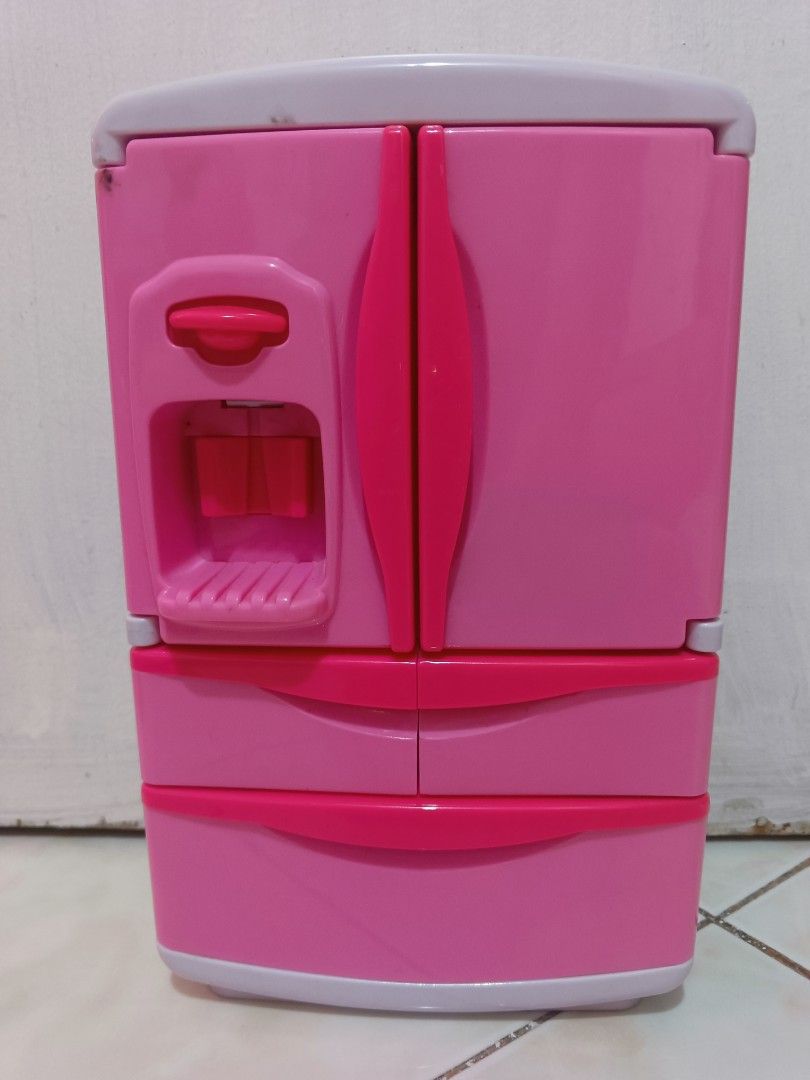 Pink Plastic Toy Refrigerator Playset with Accessories (Category: Kids Toys) located in Manila. Submitted by xxxmateo (Listing ID 1470972287, Image 1). Description: - Adorable pink and white toy refrigerator for kids' playtime - Realistic double-door design with opening bottom freezer drawers - Features a fun pretend water dispenser on the front door - Comes with miniature play food: shake cup, ice cream cone, popsicles, soda cans, snacks, and eg