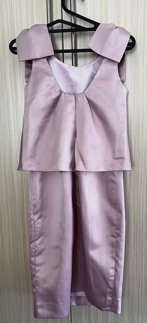 Pink Satin Dress with Bow Straps (Category: Dresses) located in Manila. Submitted by lorenasant37621 (Listing ID 1470985255, Image 2). Description: - Color: Dusty Pink - Material: Smooth satin with subtle sheen - Design: Thick bow shoulder straps, layered overlay top, fitted skirt - Back detail: Unique draped pleat design with concealed zipper - Length: Approx. 36 inches - Perfect for weddings, parties, and special occasions!.