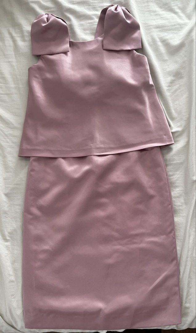 Pink Satin Dress with Bow Straps (Category: Dresses) located in Manila. Submitted by lorenasant37621 (Listing ID 1470985255, Image 3). Description: - Color: Dusty Pink - Material: Smooth satin with subtle sheen - Design: Thick bow shoulder straps, layered overlay top, fitted skirt - Back detail: Unique draped pleat design with concealed zipper - Length: Approx. 36 inches - Perfect for weddings, parties, and special occasions!.