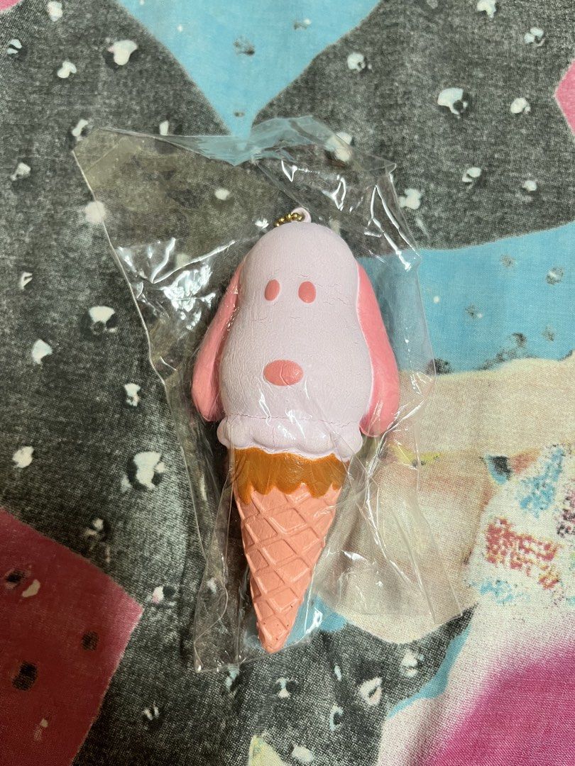 Pink Snoopy Ice Cream Cone Squishy Toy (Category: Kids Toys) located in Manila. Submitted by leiluvsu (Listing ID 1471086415, Image 1). Description: - Adorable pink Snoopy ice cream cone design - Features a realistic waffle cone bottom and brown drizzle detail - Made from ultra-soft, slow-rising foam material - Equipped with a gold ball chain for easy hanging - Lightly used and comes in clear plastic packaging - Has minimal cracks.