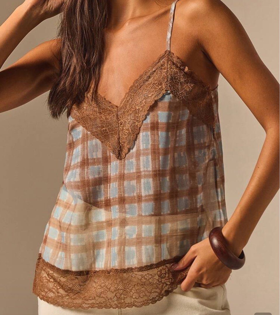 Plaid Camisole Top with Lace Trim (Category: Sleeveless) located in Las Pinas. Submitted by dhen.declutters (Listing ID 1470980482, Image 1). Description: - Trendy blue and brown plaid print - Delicate brown lace trim along V-neckline and bottom hem - Thin adjustable shoulder straps for a custom fit - Semi-sheer, lightweight fabric ideal for warm weather - Versatile piece that looks great with denim shorts or skirts.