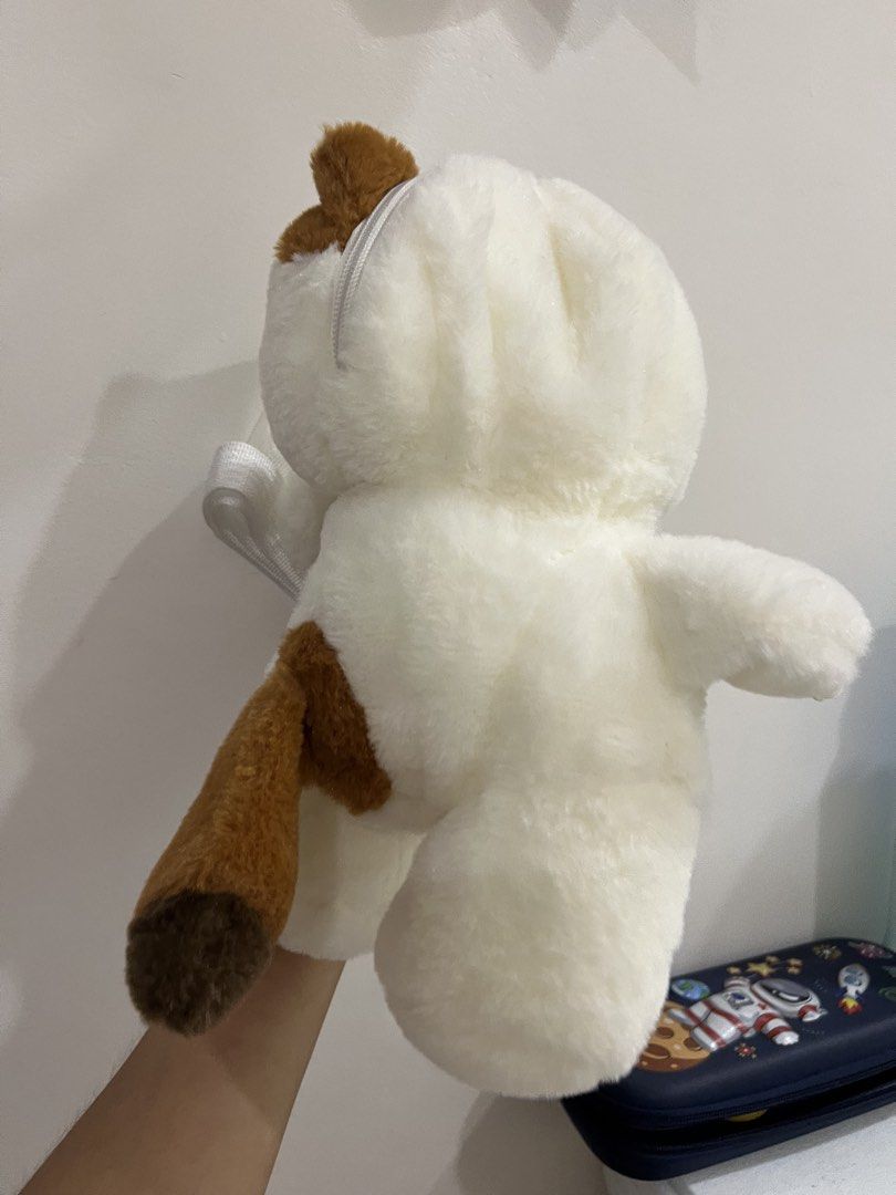 Plush Calico Cat Crossbody Bag with Heart Patch (Category: Babies & Kids Fashion) located in Quezon City. Submitted by saleinqc (Listing ID 1471056923, Image 2). Description: - Fluffy cat crossbody bag with brown and white patches - Features a cute embroidered brown heart on the front - Secure zipper closure at the back - Spacious fabric-lined inner compartment - Includes a white adjustable and detachable strap with plastic clips - Soft and cuddl