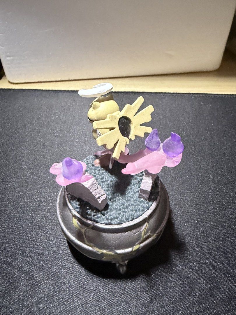 Pokemon Shedinja Ghost Cauldron Diorama Figure (Category: Figurines & Statues) located in Mandaluyong City. Submitted by juliansthings (Listing ID 1471089674, Image 2). Description: - Custom Shedinja figure featuring a spooky cauldron base - Accented with translucent pink and purple ghost flame effects and two tombstones - Detailed weathered pot design with glowing green cracks - Stands upright when assembled properly. Please see 3rd image for th