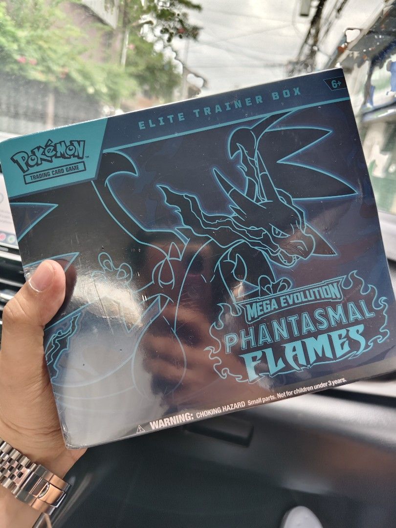 Pokémon Mega Evolution: Phantasmal Flames Elite Trainer Box (ETB) English (Category: Card Boxes & Cases) located in Manila. Submitted by rarewind.cb1244 (Listing ID 1471060381, Image 1). Description: - 100% Brand New & Factory Sealed Pokémon TCG: Mega Evolution - Phantasmal Flames Elite Trainer Box - Stunning Mega Charizard X packaging and collector's box - 9 Booster packs to expand your collection - 1 Full-art foil promo card featuring Charcadet