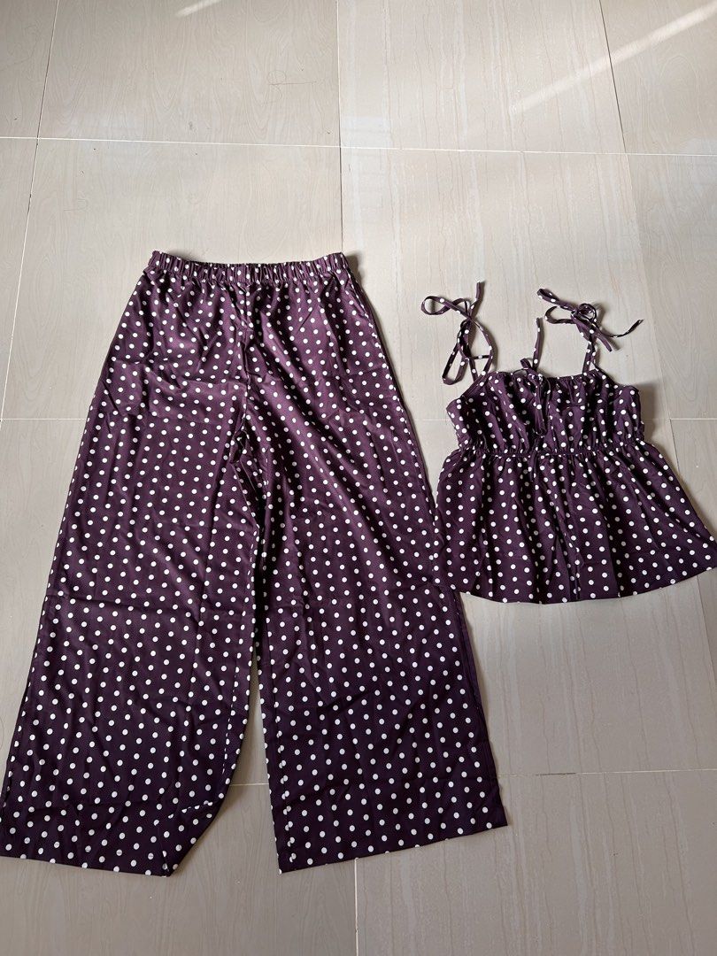 Polka Dot Two-Piece Top and Pants Set - L (Category: Sets or Coordinates) located in Caloocan City. Submitted by declutterieee (Listing ID 1471008997, Image 2). Description: - Style: two-piece set with white polka dots - Top: Sleeveless with adjustable tie straps and gathered ruffled hem - Bottoms: High-waist wide-leg pants with a comfy elastic waistband - Material: Lightweight and breathable fabric - Perfect for: Casual warm-weather days or styl