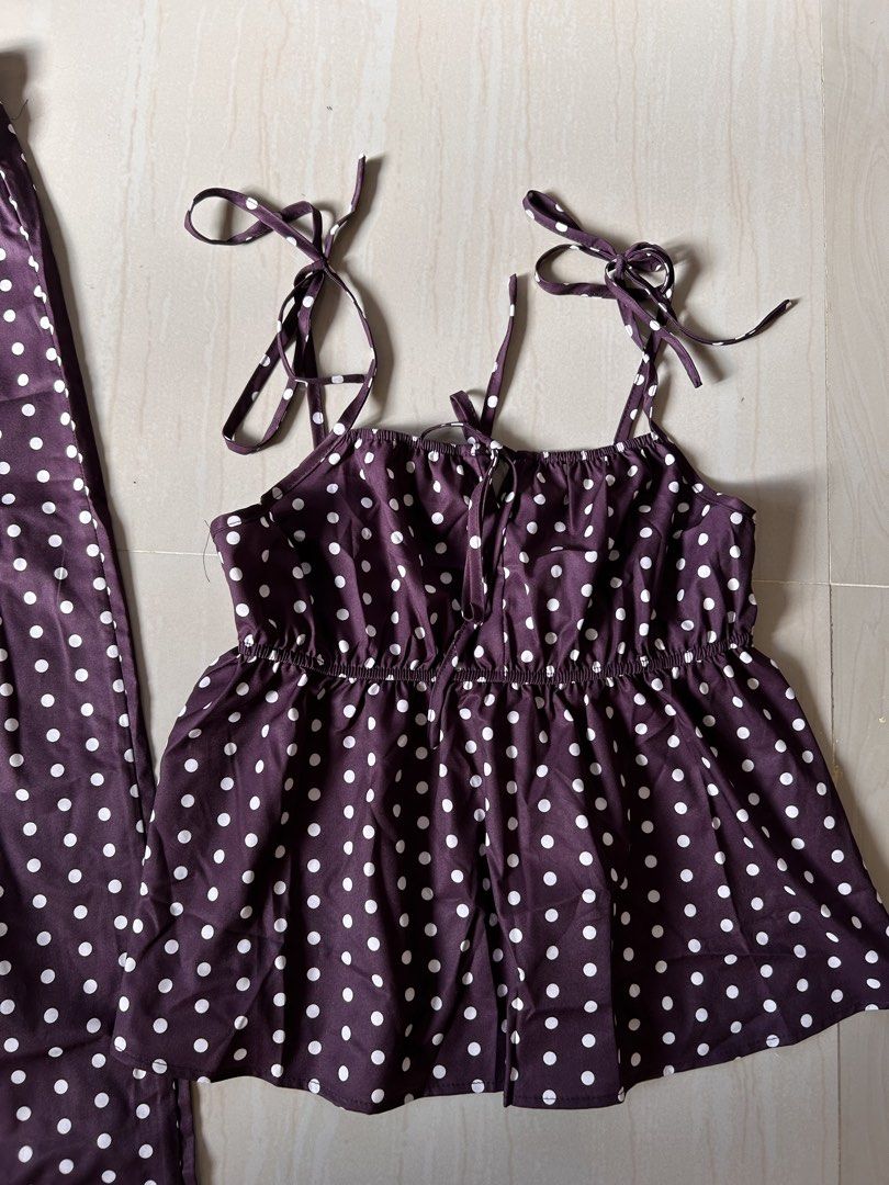Polka Dot Two-Piece Top and Pants Set - L (Category: Sets or Coordinates) located in Caloocan City. Submitted by declutterieee (Listing ID 1471008997, Image 3). Description: - Style: two-piece set with white polka dots - Top: Sleeveless with adjustable tie straps and gathered ruffled hem - Bottoms: High-waist wide-leg pants with a comfy elastic waistband - Material: Lightweight and breathable fabric - Perfect for: Casual warm-weather days or styl