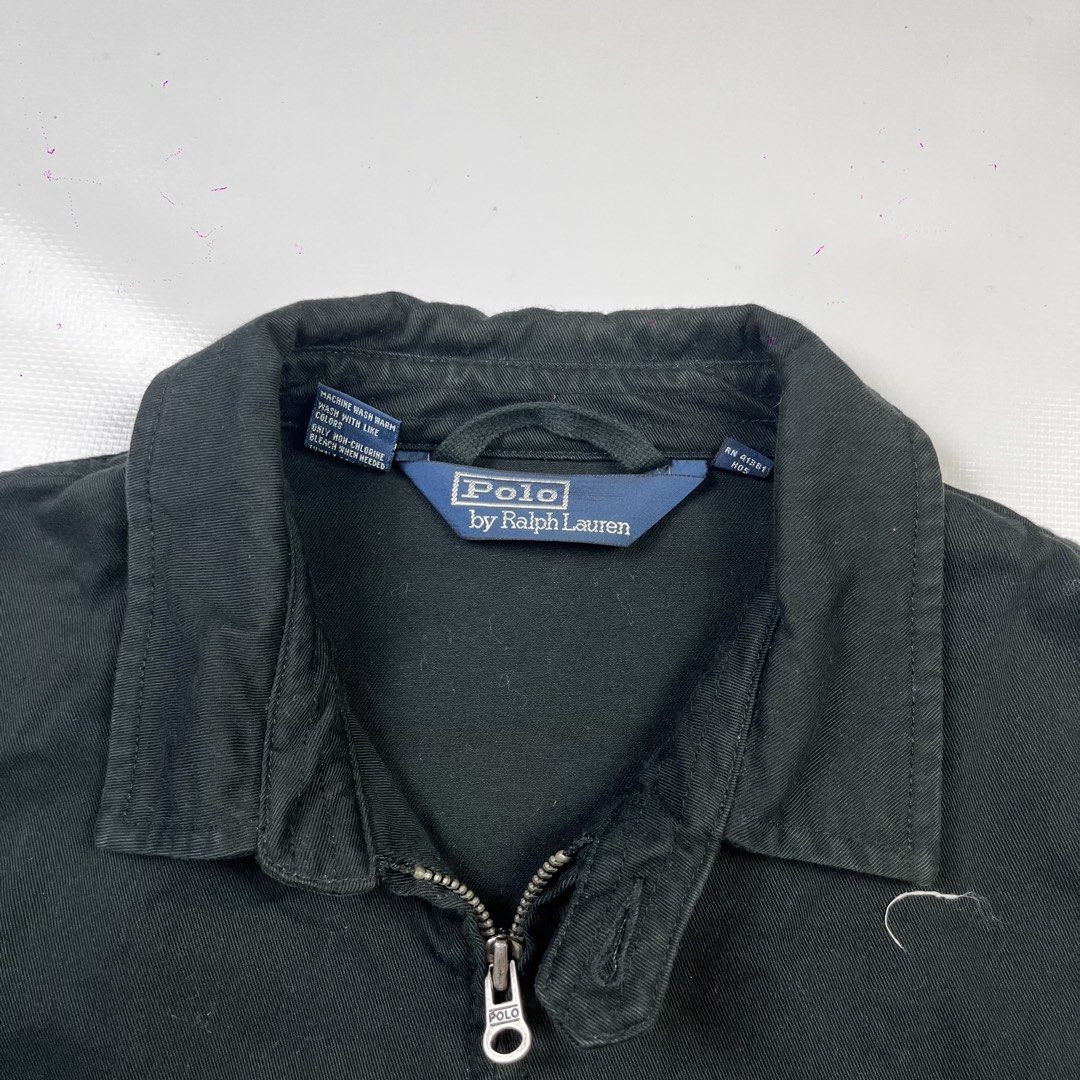 Polo by Ralph Lauren Black Zip Jacket (Category: Coats, Jackets and Outerwear) located in Lucena. Submitted by nifty_finds (Listing ID 1470977047, Image 3). Description: - Brand: Polo by Ralph Lauren - Style: Classic black zip-up jacket - Color: Black with blue embroidered pony logo - Details: Pointed collar, full metal zipper closure, front pockets, and button cuffs - Label: Authentic blue label inside collar - Condition: Excellent / Well-mainta