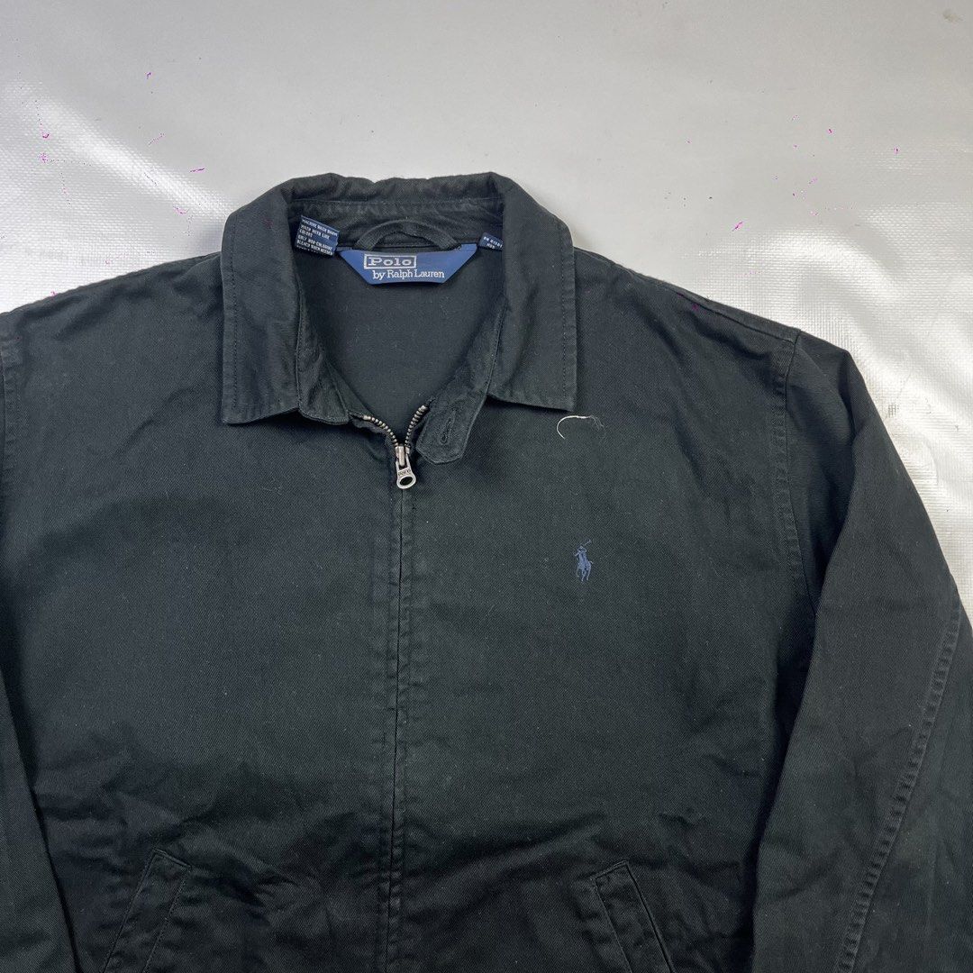 Polo by Ralph Lauren Black Zip Jacket (Category: Coats, Jackets and Outerwear) located in Lucena. Submitted by nifty_finds (Listing ID 1470977047, Image 2). Description: - Brand: Polo by Ralph Lauren - Style: Classic black zip-up jacket - Color: Black with blue embroidered pony logo - Details: Pointed collar, full metal zipper closure, front pockets, and button cuffs - Label: Authentic blue label inside collar - Condition: Excellent / Well-mainta