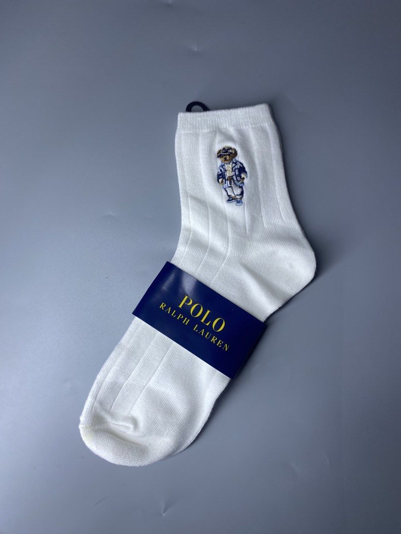 Polo Ralph Lauren Bear White Socks (Category: Socks) located in Dagupan City. Submitted by vell25apparel (Listing ID 1470937504, Image 1). Description: - Brand: Polo Ralph Lauren - Item: White ribbed crew socks with iconic embroidered Polo Bear - Condition: Brand new with original tags and blue paper band - Size: One size (fits men's 25 to 27 cm) - Material: Soft and comfortable cotton blend - Flaws: None, never worn.