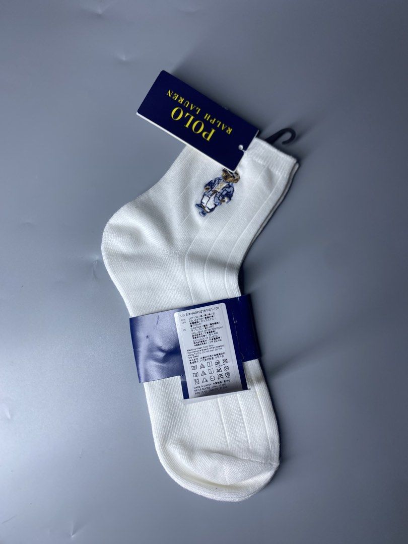Polo Ralph Lauren Bear White Socks (Category: Socks) located in Dagupan City. Submitted by vell25apparel (Listing ID 1470937504, Image 2). Description: - Brand: Polo Ralph Lauren - Item: White ribbed crew socks with iconic embroidered Polo Bear - Condition: Brand new with original tags and blue paper band - Size: One size (fits men's 25 to 27 cm) - Material: Soft and comfortable cotton blend - Flaws: None, never worn.