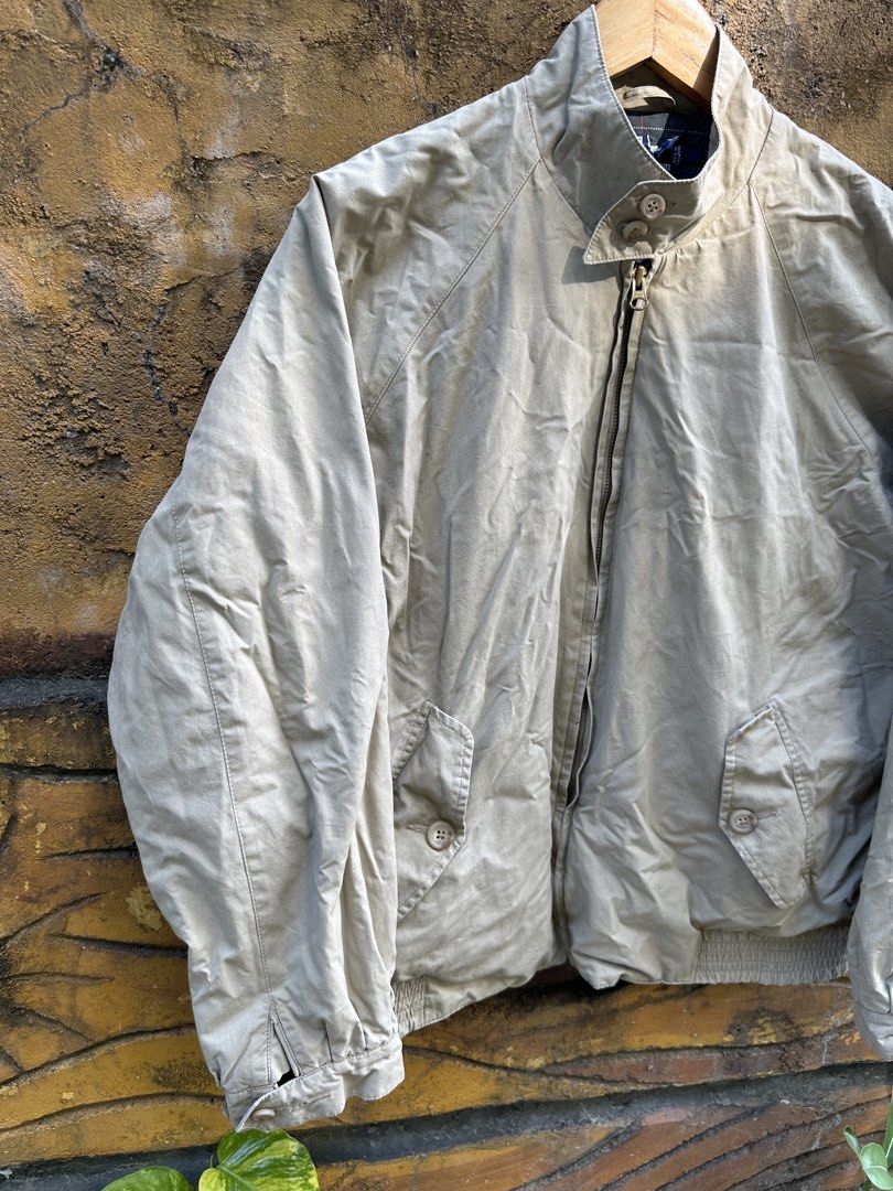 Polo Ralph Lauren Beige Harrington Jacket Plaid Lined (Category: Coats, Jackets and Outerwear) located in Urdaneta. Submitted by redeemedcollective (Listing ID 1471066567, Image 2). Description: Polo by Ralph Lauren Harrington-style jacket in a classic beige/khaki colorway, featuring a navy and green plaid interior lining. • Brand: Polo by Ralph Lauren • Color: Beige / Khaki • Size: Tag not clearly readable • Full front YKK zipper closure • Stand