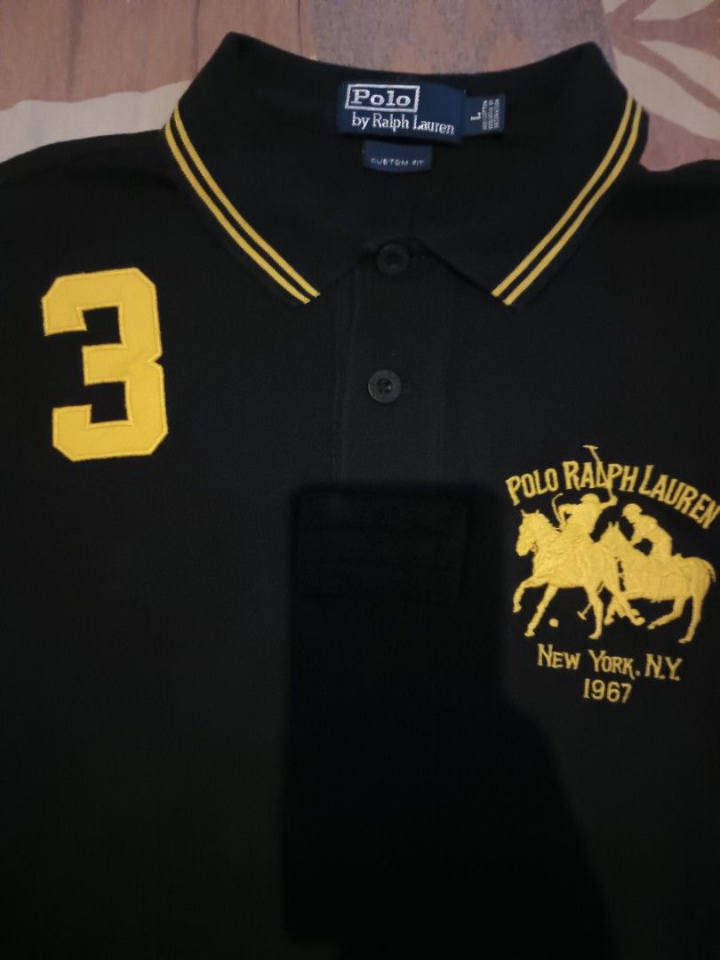Polo ralph Lauren polo shirts (Category: Activewear) located in Odiongan. Submitted by thriftngo26 (Listing ID 1471113407, Image 2). Description: The image shows a Polo Ralph Lauren "New York" Big Pony polo shirt in black with yellow accents, often referred to in streetwear circles as the "Chief Keef style" crest polo..