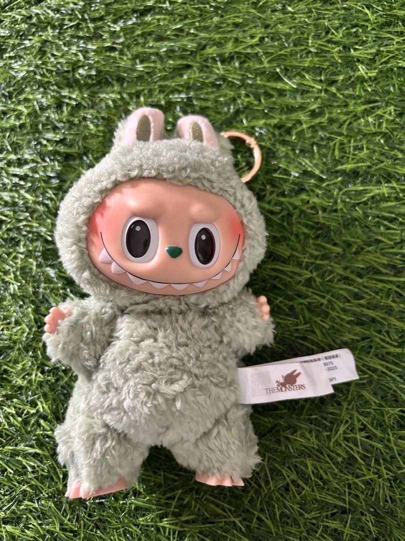 Pop Mart The Monsters Labubu Macaron Green Grape (Category: Designer & Blind Box Toys) located in Makati City. Submitted by rare_thrift_stuff (Listing ID 1470964091, Image 1). Description: - Authentic Pop Mart The Monsters blind box vinyl plush pendant - Rare Green Grape colourway from the popular Macaron series by Kasing Lung - Features a soft fuzzy body, adorable pink face, and signature mischievous grin - Equipped with a sturdy keychain ring f