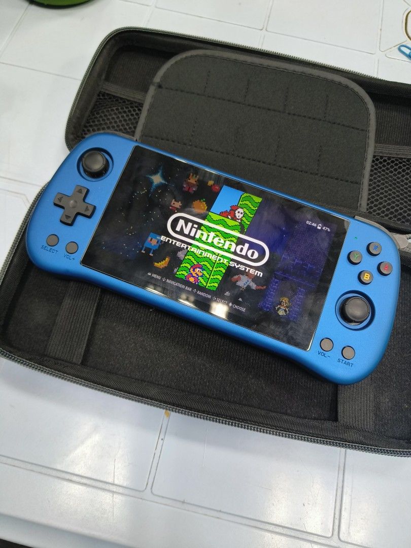 Powkiddy X55 Handheld Retro Game Console Blue (Category: Nintendo) located in Manila. Submitted by bigtym.picker (Listing ID 1470934206, Image 3). Description: almost new hi di halos nagamit unit only w/ case no charger slight nego - Model: Powkiddy X55 Handheld Console (Blue) - OS: Runs ROCKNIX operating system - Accessories: Includes fitted hard storage case with zipper and mesh pockets - Condition: Clean outer shell with fully functional scree