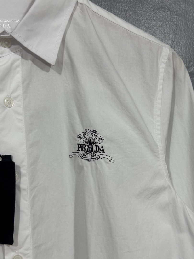 Prada - Button Up Long Sleeve Polo (Category: Tshirts & Polo Shirts ) located in Manila. Submitted by sophisticatedgoons (Listing ID 1471043145, Image 3). Description: Prada White Polo Long Sleeve Size: Small Dimes: 19 x 27-29 Brandnew with tag No issue Needs little wash.