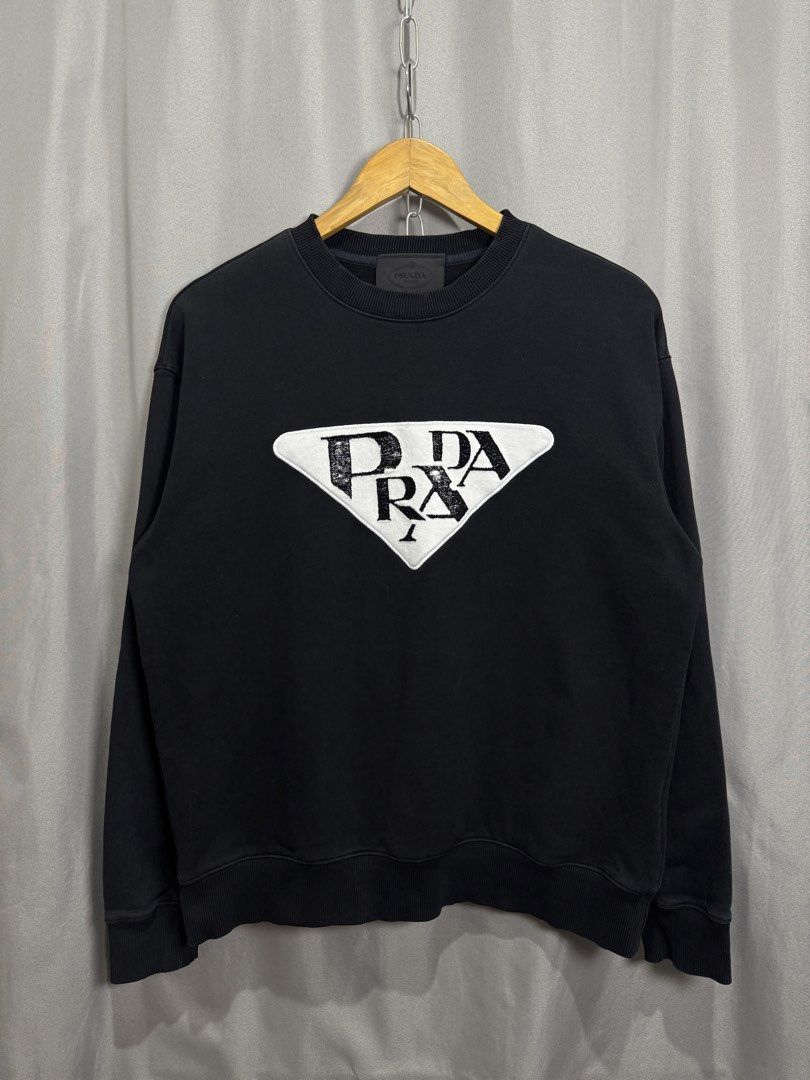 Prada Big Logo Sweater (Category: Coats, Jackets and Outerwear) located in Meycauayan. Submitted by itstimothrifts (Listing ID 1471005407, Image 1). Description: Prada Big Logo Sweater Excellent Condition No flaws Size 46 on tag Medium W 22 L 25.5.