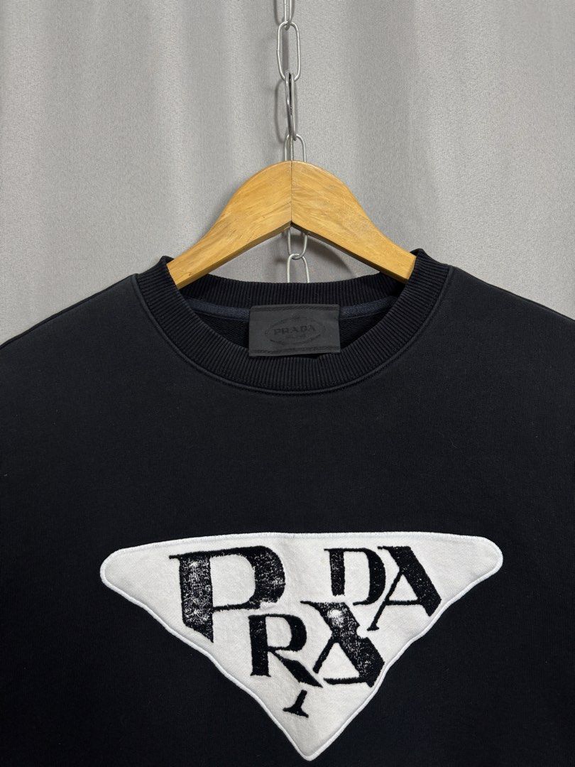 Prada Big Logo Sweater (Category: Coats, Jackets and Outerwear) located in Meycauayan. Submitted by itstimothrifts (Listing ID 1471005407, Image 2). Description: Prada Big Logo Sweater Excellent Condition No flaws Size 46 on tag Medium W 22 L 25.5.
