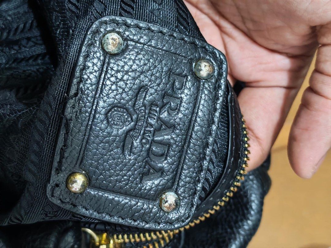 Prada Black Leather Handbag (Category: Luxury Bags & Wallets) located in Baguio. Submitted by thriftedbaguio (Listing ID 1471094562, Image 3). Description: Very Good condition Color rate 9.5 With sign of use .