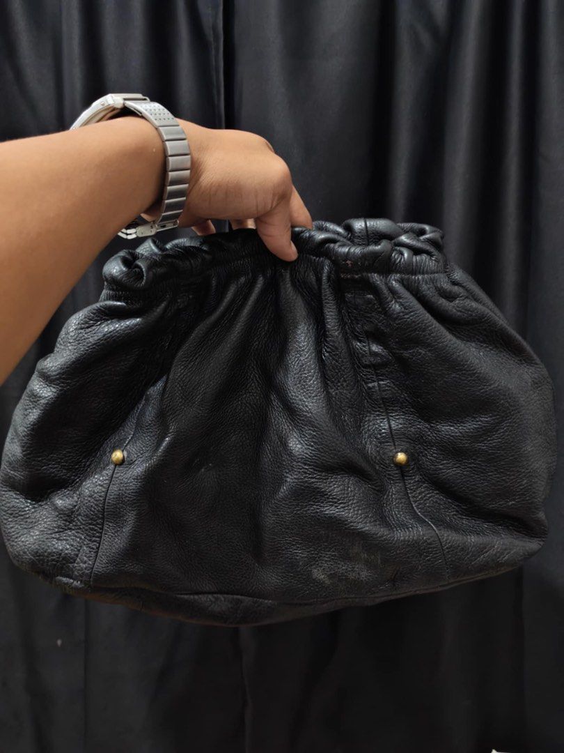Prada Black Leather Handbag (Category: Luxury Bags & Wallets) located in Baguio. Submitted by thriftedbaguio (Listing ID 1471094562, Image 2). Description: Very Good condition Color rate 9.5 With sign of use .