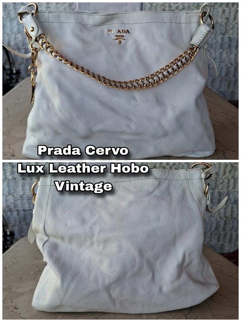 Prada Cervo Lux Leather Hobo Vintage (Category: Luxury Bags & Wallets) located in Manila. Submitted by jujutwo (Listing ID 1471087311, Image 1). Description: - Authentic Prada hobo bag crafted from soft white Cervo leather - Elegant gold hardware throughout with a chunky chain detail interwoven with leather straps - Classic Prada logo lettering stamped dead center - Beautiful, slouchy body shape for an effortless look - Condition: Zippers and han
