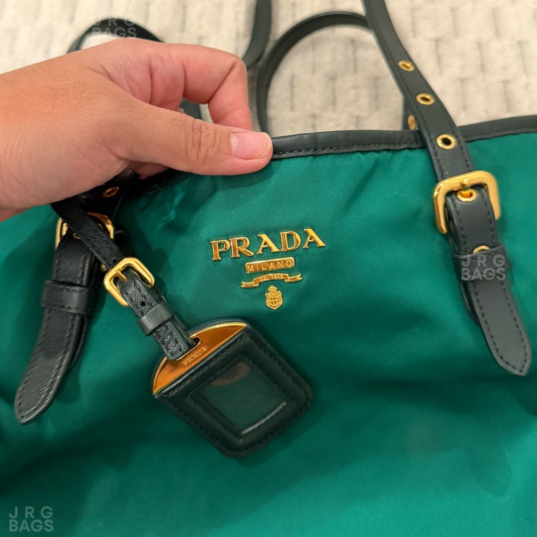 Prada Green Nylon Tote Bag (Category: Luxury Bags & Wallets) located in Paranaque City. Submitted by juliasmomsy (Listing ID 1471007672, Image 3). Description: Selling my pre-loved bags! Authentic Prada Nylon Tote Bag with Saffiano-Trimmed straps - SIZE: L: 36 cm, H: 31 cm, W: 15 cm , Handle drop: 30 cm (adjustable) - COLOR: Emerald Green - MATERIAL: Nylon with Saffiano-Trimmed Straps - OTHER DETAILS: Gold-toned hardware. - CONDITION: Used. Leath