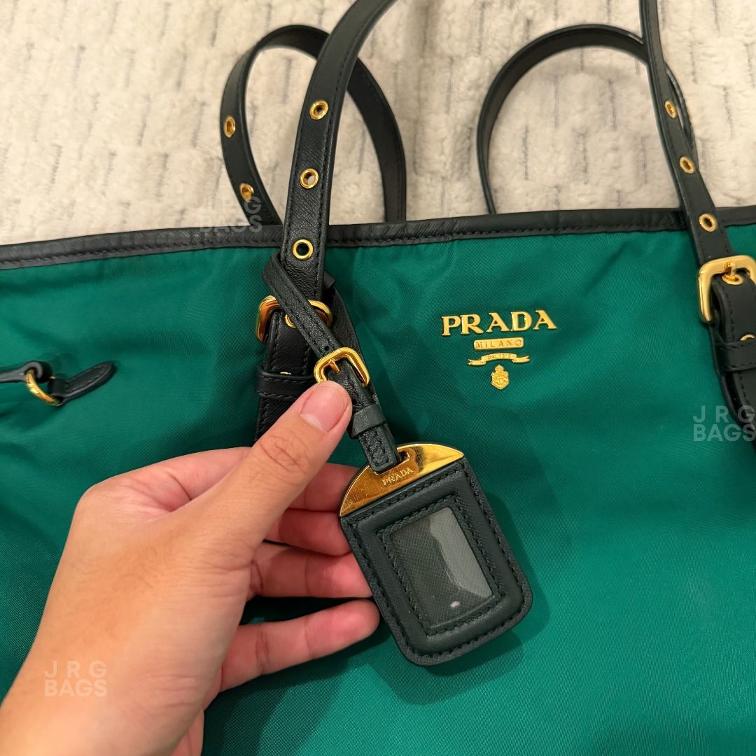 Prada Green Nylon Tote Bag (Category: Luxury Bags & Wallets) located in Paranaque City. Submitted by juliasmomsy (Listing ID 1471007672, Image 2). Description: Selling my pre-loved bags! Authentic Prada Nylon Tote Bag with Saffiano-Trimmed straps - SIZE: L: 36 cm, H: 31 cm, W: 15 cm , Handle drop: 30 cm (adjustable) - COLOR: Emerald Green - MATERIAL: Nylon with Saffiano-Trimmed Straps - OTHER DETAILS: Gold-toned hardware. - CONDITION: Used. Leath