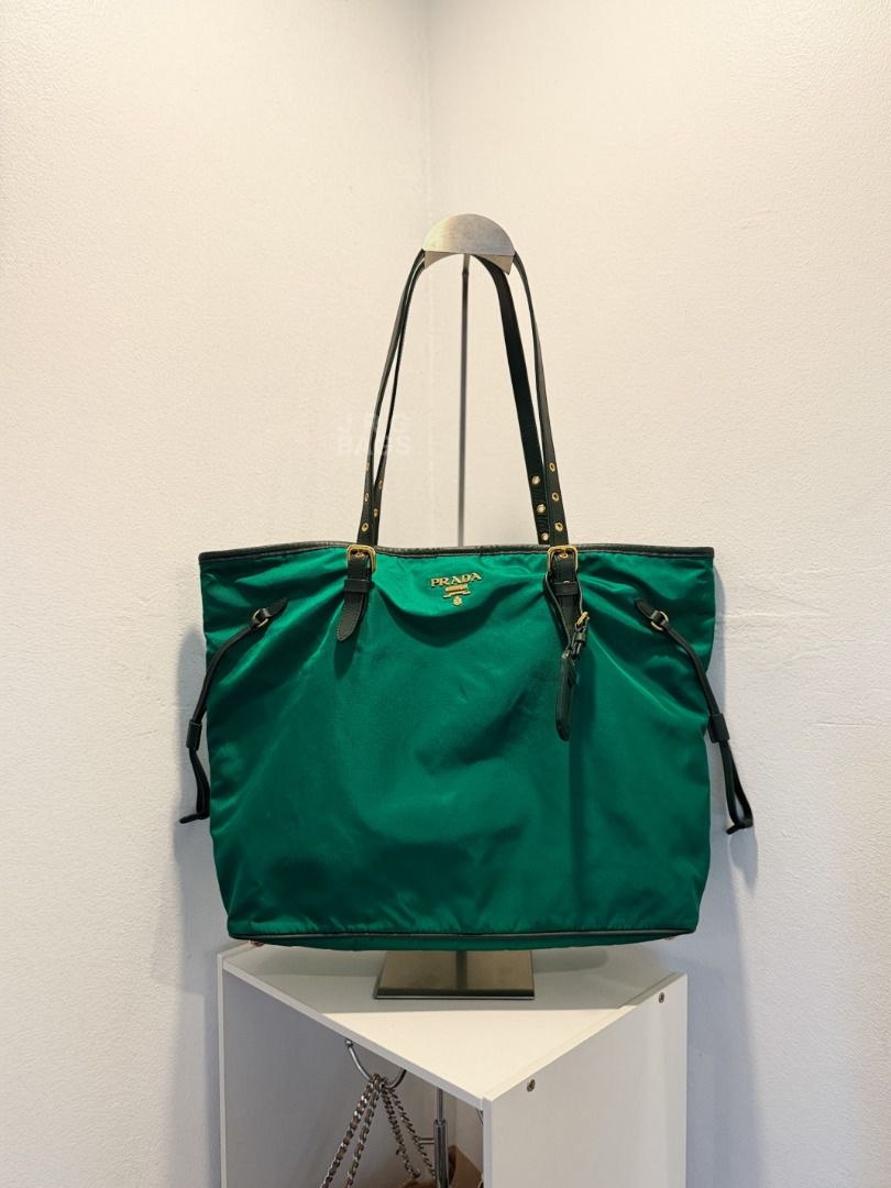 Prada Green Nylon Tote Bag (Category: Luxury Bags & Wallets) located in Paranaque City. Submitted by juliasmomsy (Listing ID 1471007672, Image 1). Description: Selling my pre-loved bags! Authentic Prada Nylon Tote Bag with Saffiano-Trimmed straps - SIZE: L: 36 cm, H: 31 cm, W: 15 cm , Handle drop: 30 cm (adjustable) - COLOR: Emerald Green - MATERIAL: Nylon with Saffiano-Trimmed Straps - OTHER DETAILS: Gold-toned hardware. - CONDITION: Used. Leath