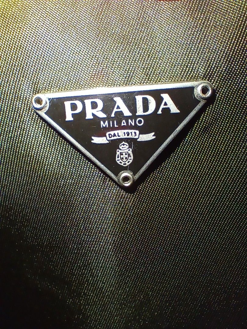 Prada khaki green nylon cosmetic zip pouch (Category: Purses & Pouches) located in Quezon City. Submitted by threetwotwo2ndaccount (Listing ID 1471111016, Image 2). Description: Prada khaki nylon cosmetic zip pouch lampo zipper with white number tag with dust bag medium size bawal sa maselan bawal sa barat.