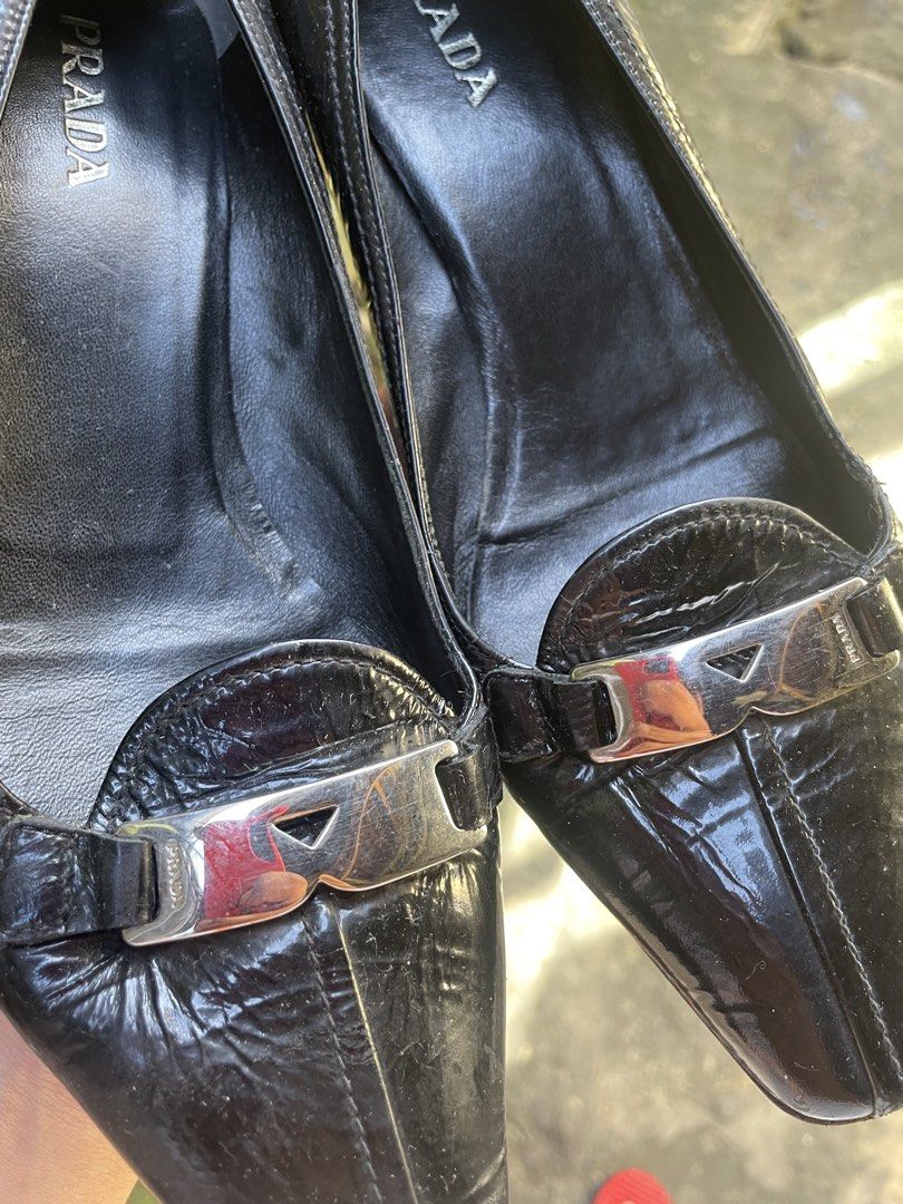 Prada Leather Heels Black (Category: Sneakers & Footwear) located in Naga. Submitted by black-market00 (Listing ID 1470993434, Image 2). Description: Prada leather heels black Size 38 1/2 Made in italy Condition 9 Minimal scratch Sign of usage .